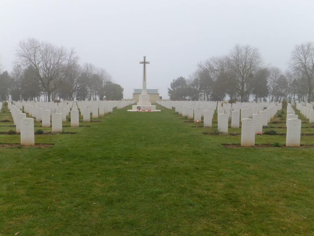 Cross and gravestones at Canadian War Cemetery near Beny-sur-Mere in northern France.