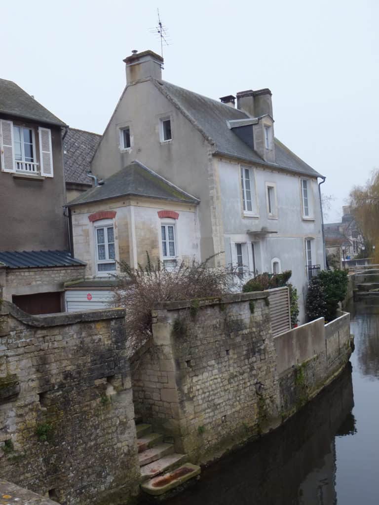 Buildings alongside canal in Bayeux, France.