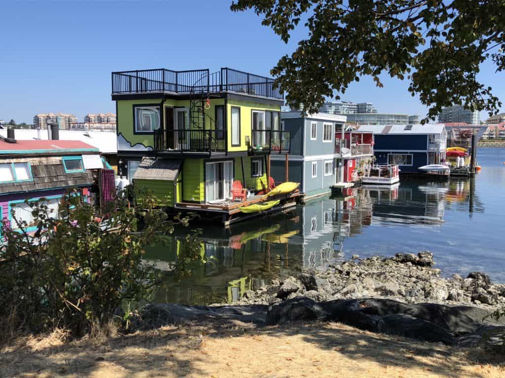 Colourful float homes sitting in the water at Fisherman's Wharf, Victoria, British Columbia.