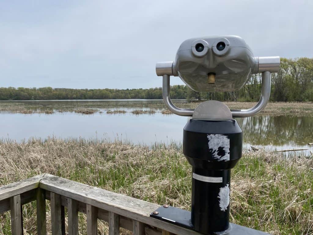 Magnifying scope on boardwalk overlooking Cootes Paradise Marsh, Hamilton, Ontario.