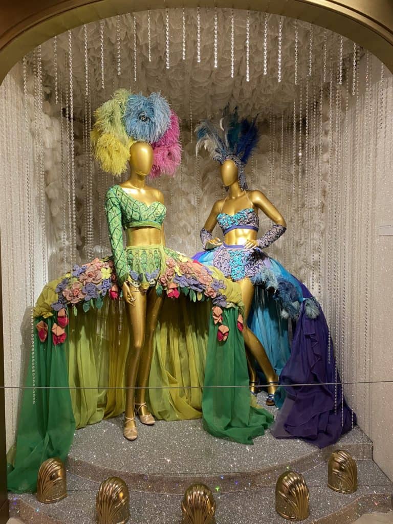 Colourful Ziegfeld Follies costumes on display on mannequins at the Museum of Broadway in New York City.