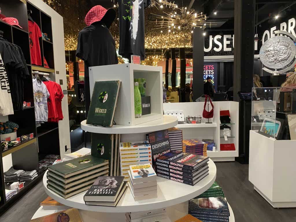 Museum of Broadway shop - books on table, merchandise displays.