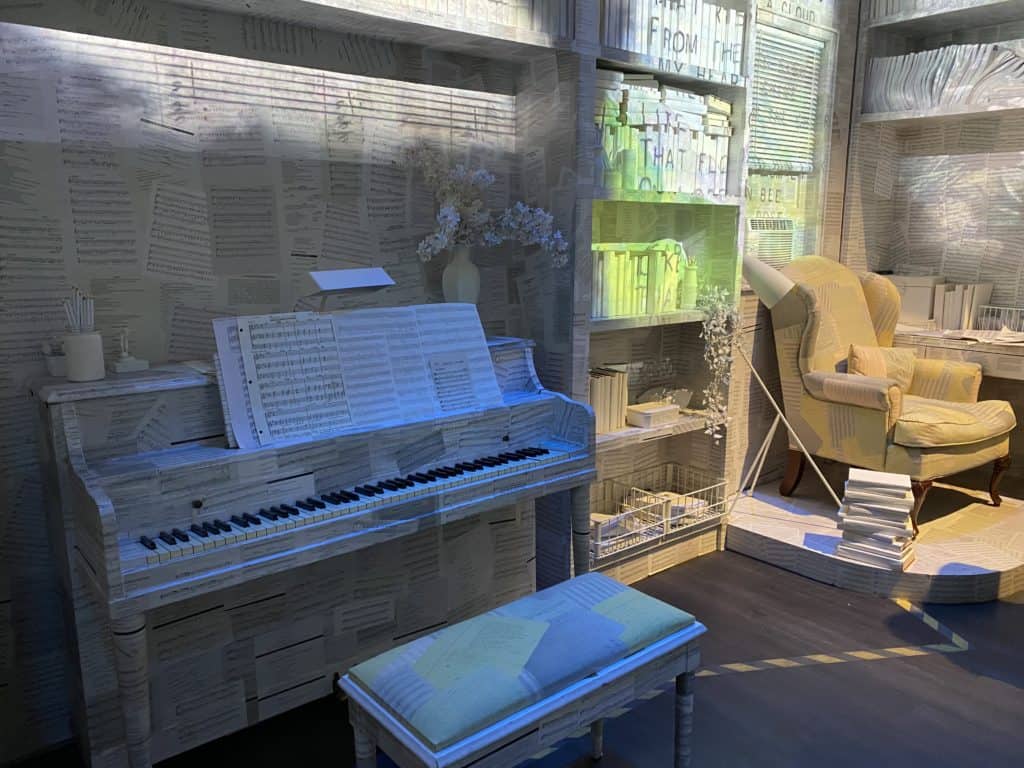 PIano, books and sheet music on display at the Museum of Broadway.