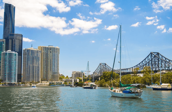 City skyline and boat in harbour, Brisbane, Australia.