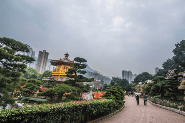 People walking on path at Chi Lin Nunnery in Hong Kong.