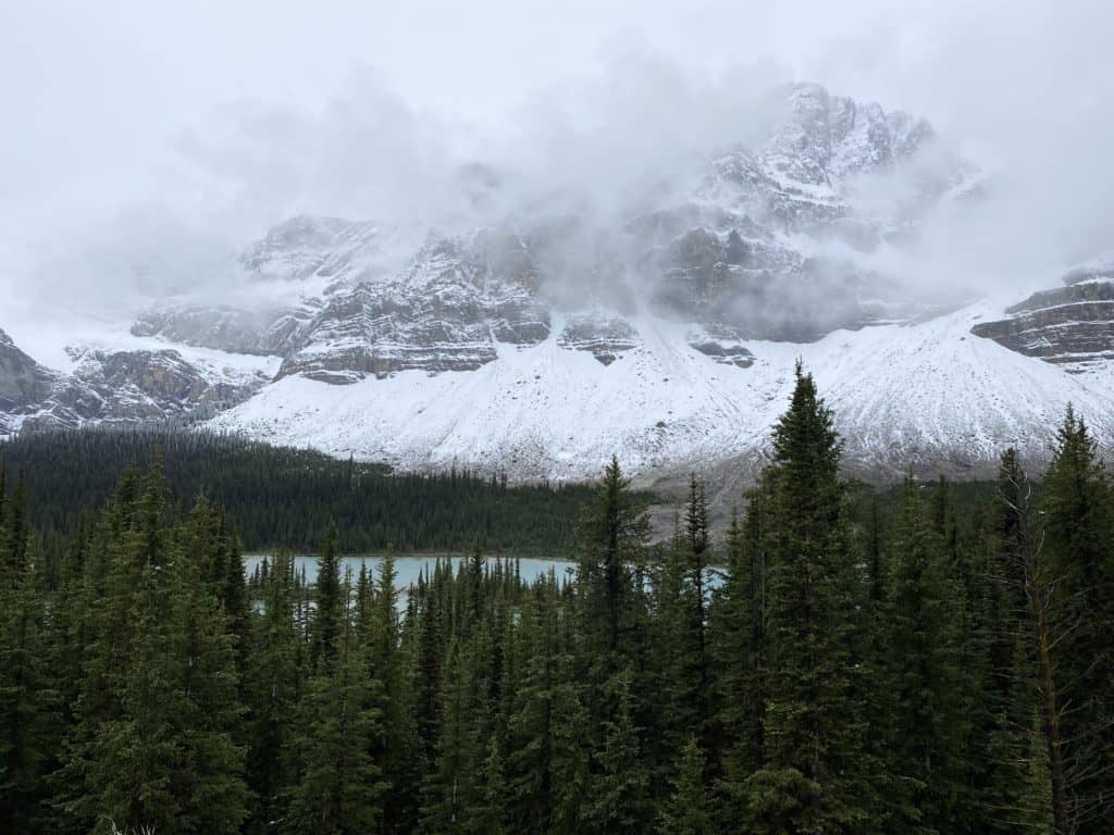 Crowfoot Glacier on overcast day with low fog cover.