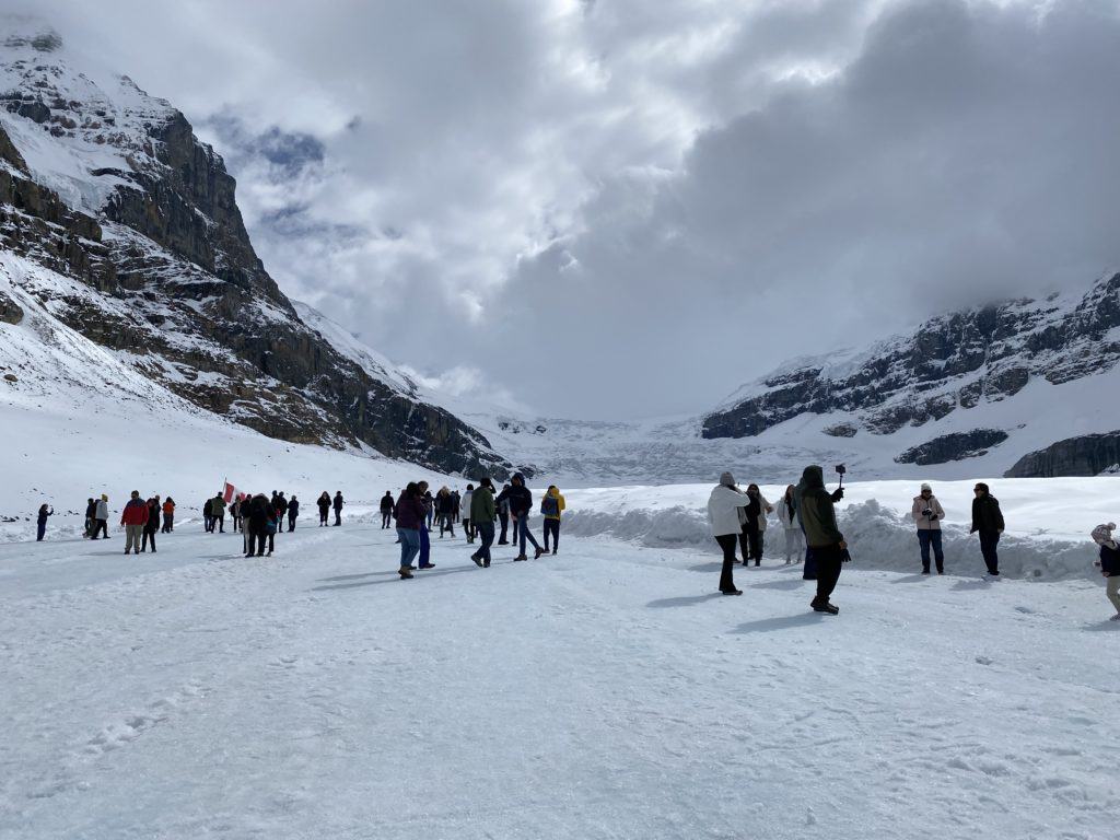People walking on the Athabasca Glacier, Icefields Parkway, Alberta, Canada.