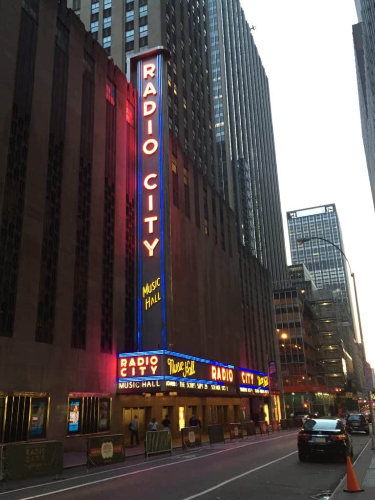 Exterior of Radio City Music Hall in New York City at night.