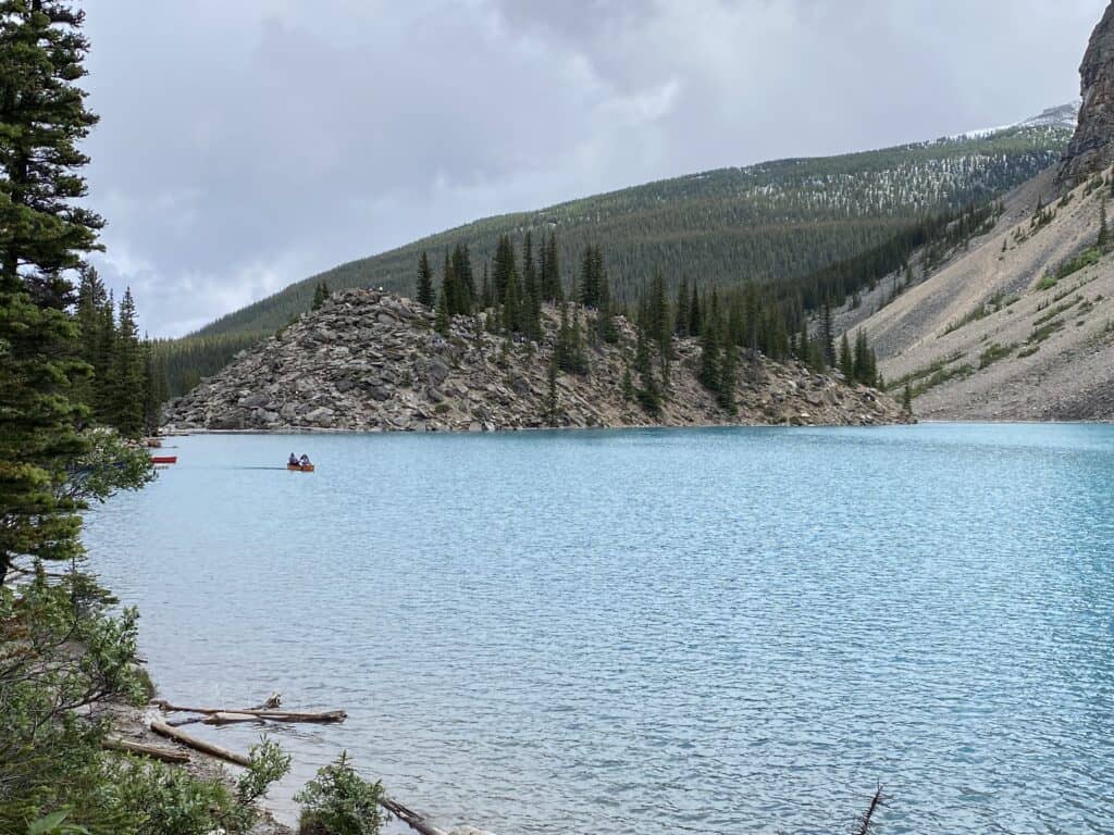 Canoe on Moraine Lake with Rockpile in background.