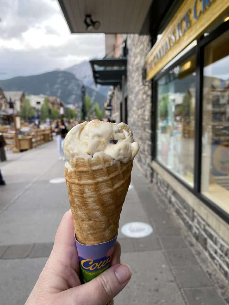 Ice cream cone - downtown Banff - mountains in background.
