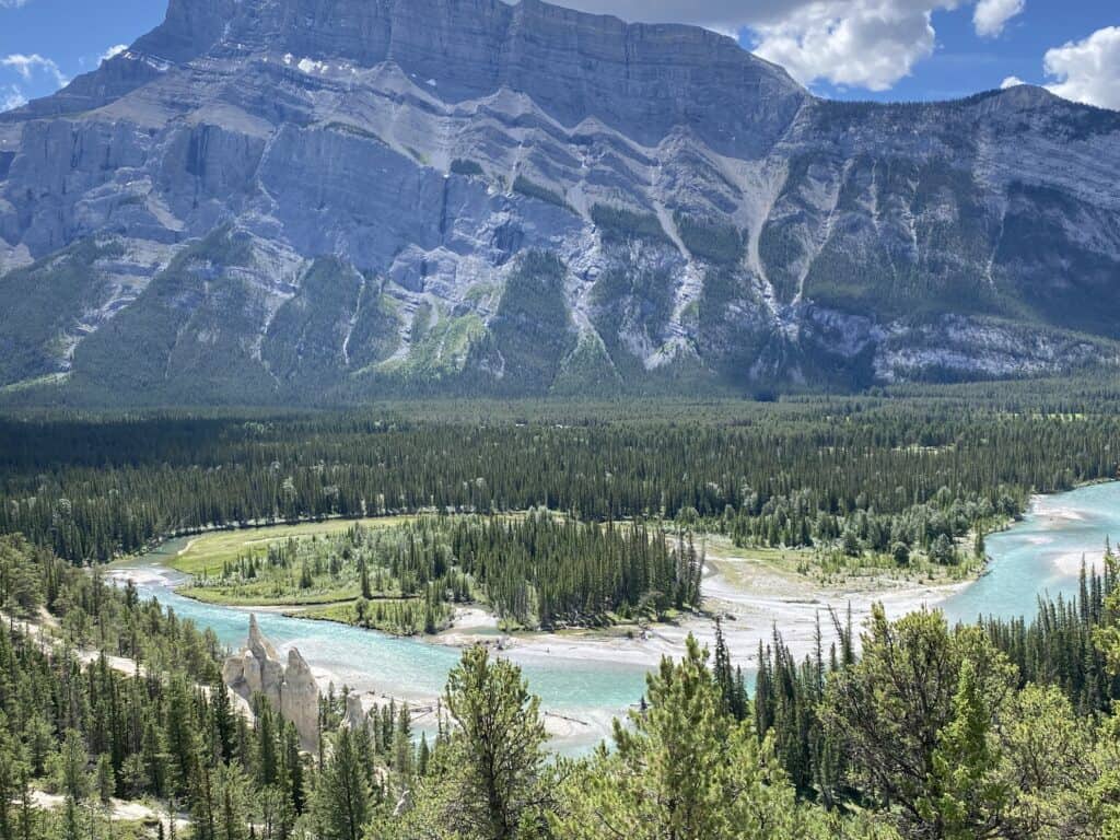 Hoodoos, river, mountains on Tunnel Mountain, Banff, Alberta, Canada.