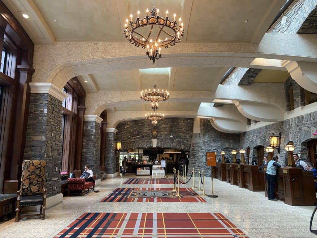 Lobby at check-in desk at the Fairmont Banff Springs Hotel.