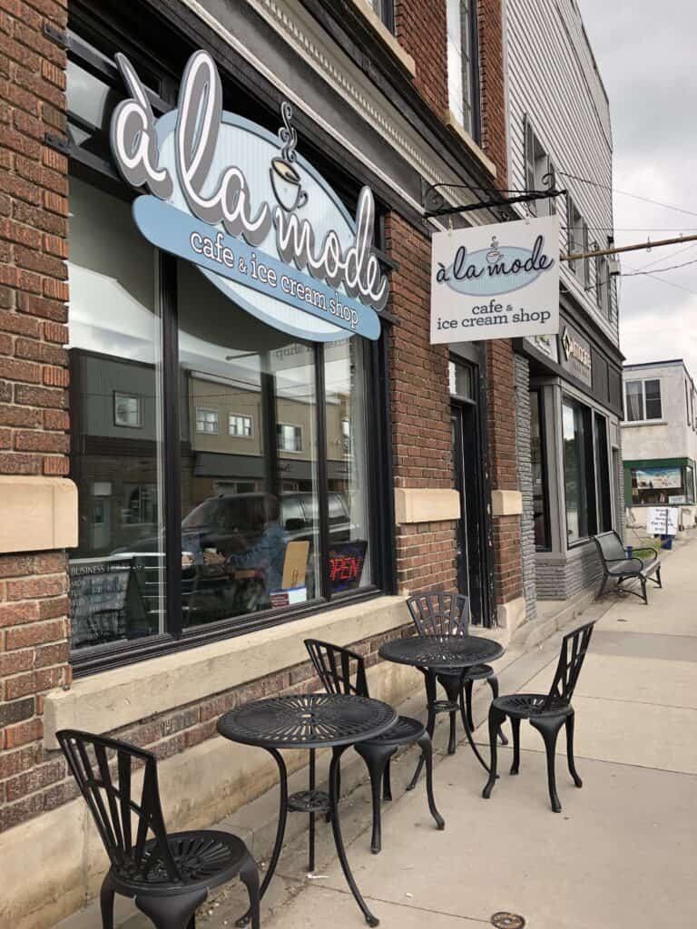 Cafe tables and chairs outside a la mode cafe and ice cream shop in Drayton, Ontario.