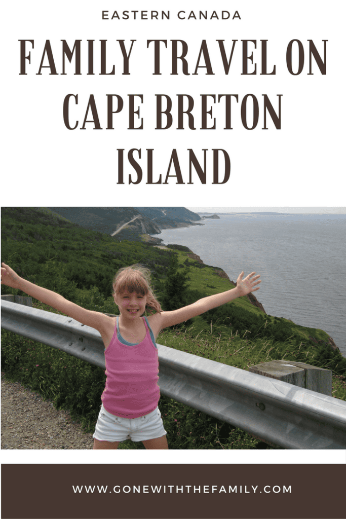 Pinterest image for Family Travel on Cape Breton Island - text overlay and photo of young girl with arms outstretched on the Cabot Trail.