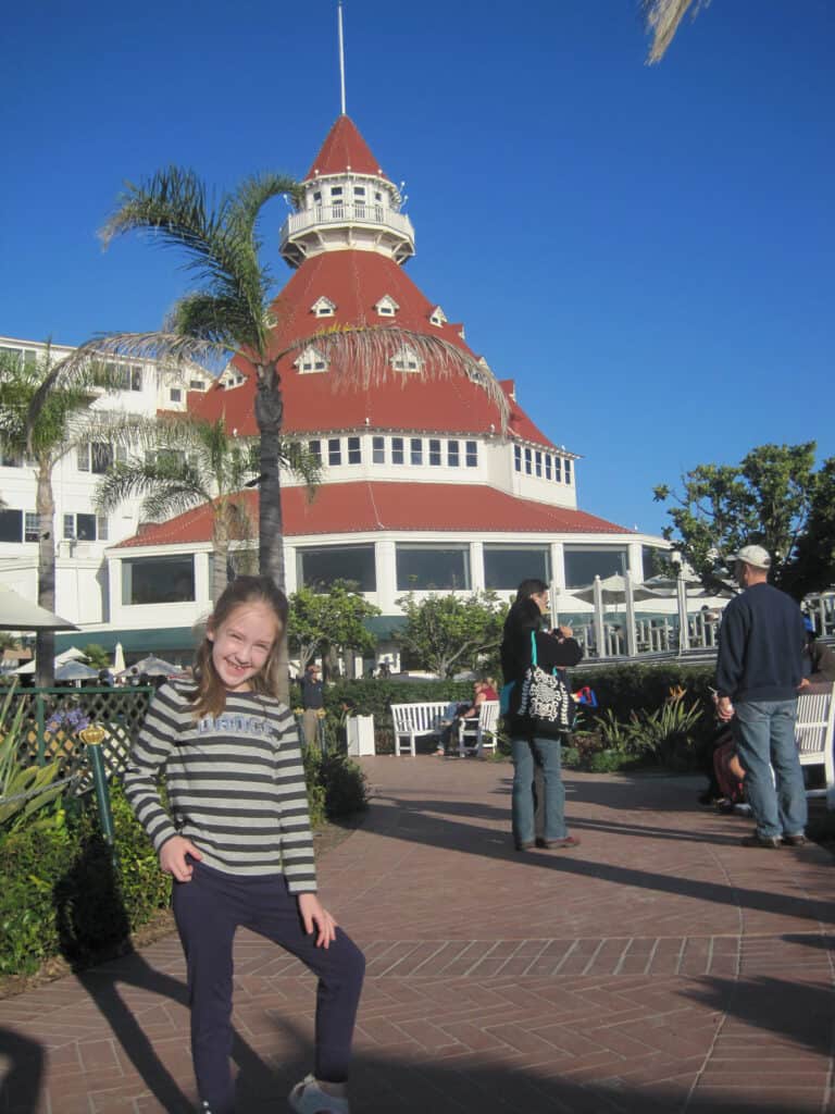 Young girl posing by Hotel Del Coronado.