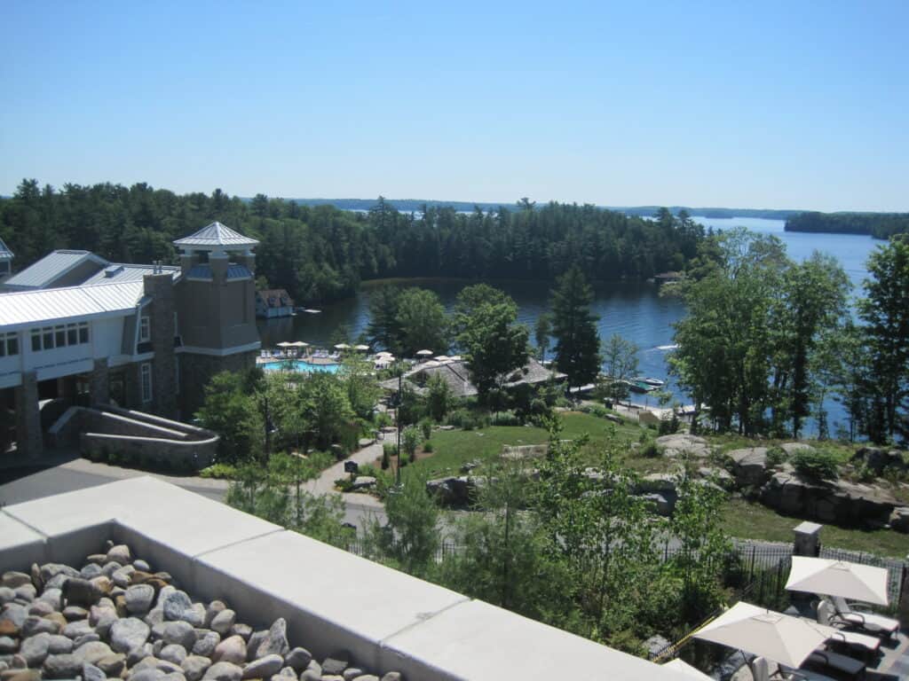 View from the terrace of the Rosseau Muskoka looking over property to the lake.