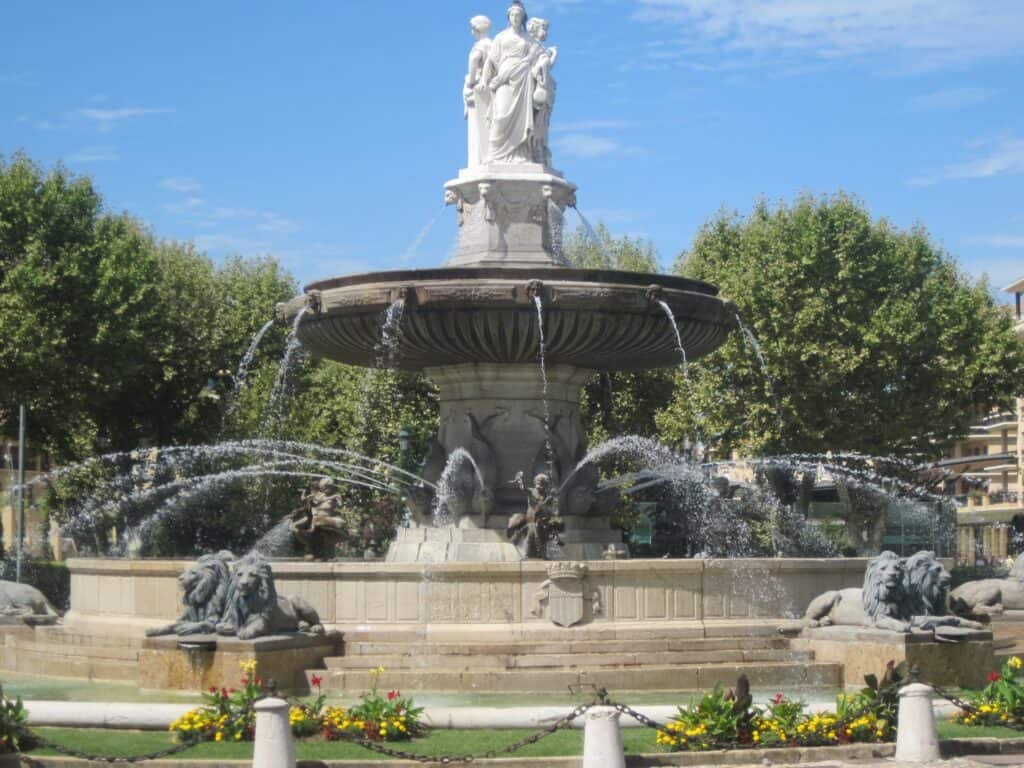 La Rotonde fountain in Aix-en-Provence  on summer day with blue sky.