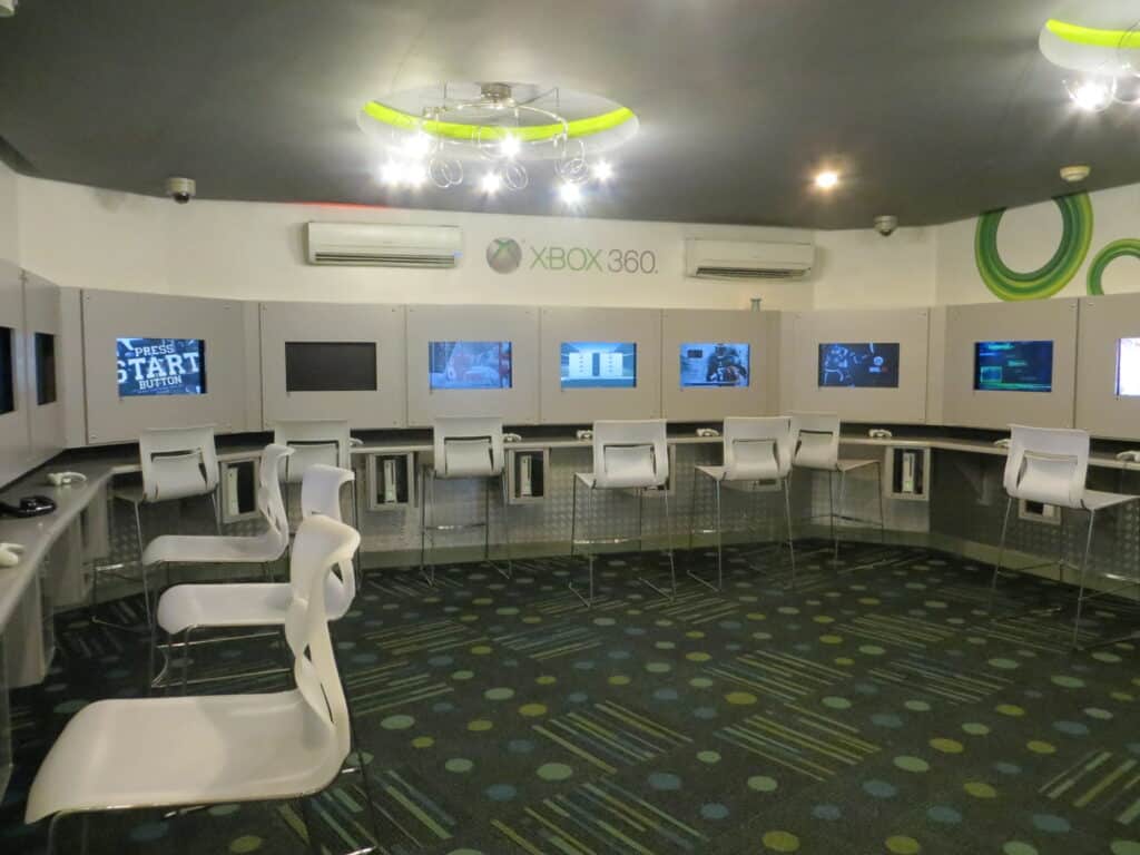 X-Box Lounge at Beaches Negril - White plastic high chairs set around X-Box stations.