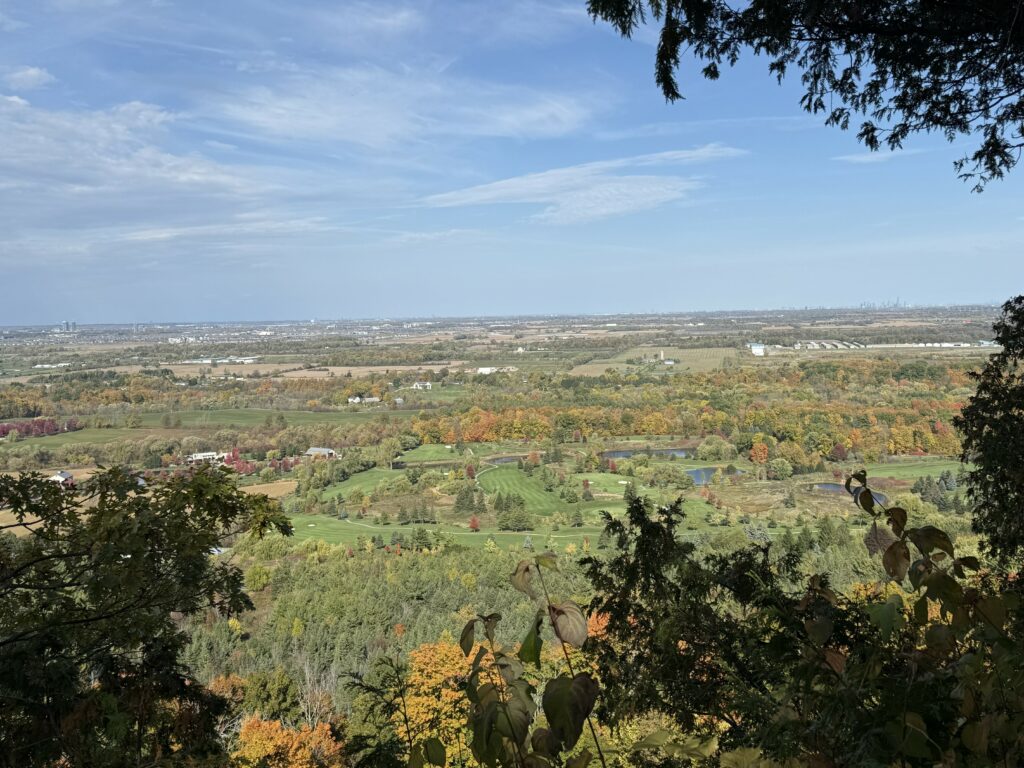 view from brock harris lookout at mount nemo of fields and trees with some fall colour.