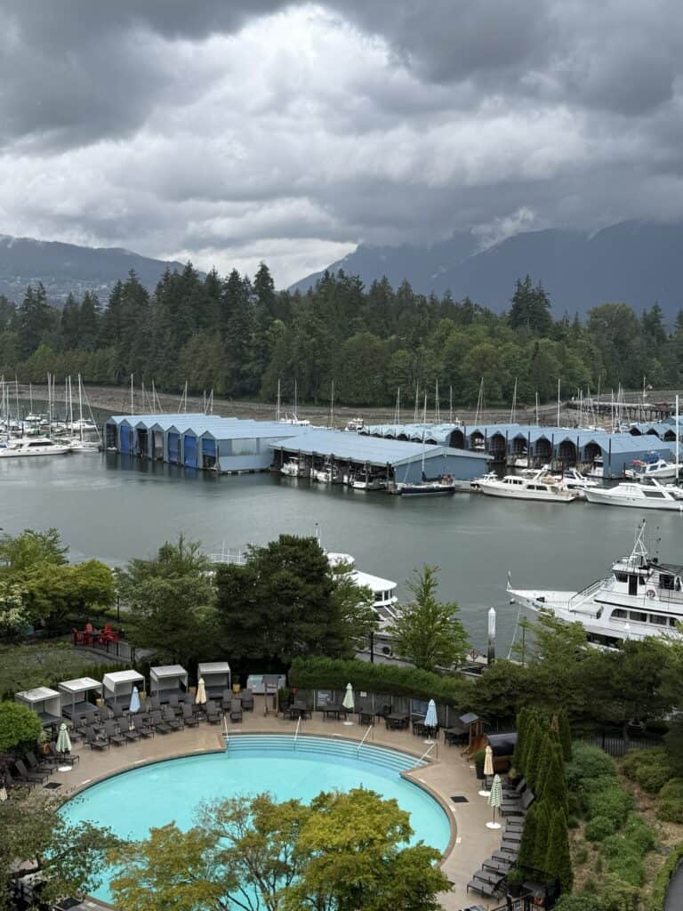 View from room looking down at round pool and marina in Vancouver.