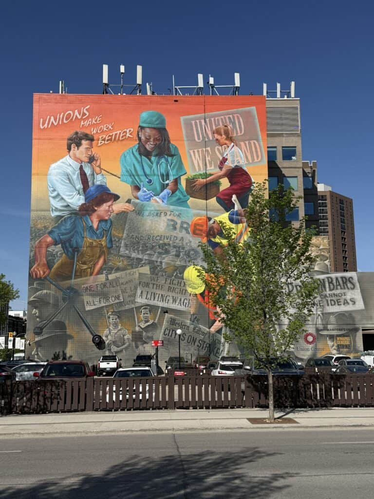 large wall mural in Winnipeg depicting the history of the labour movement in the province.