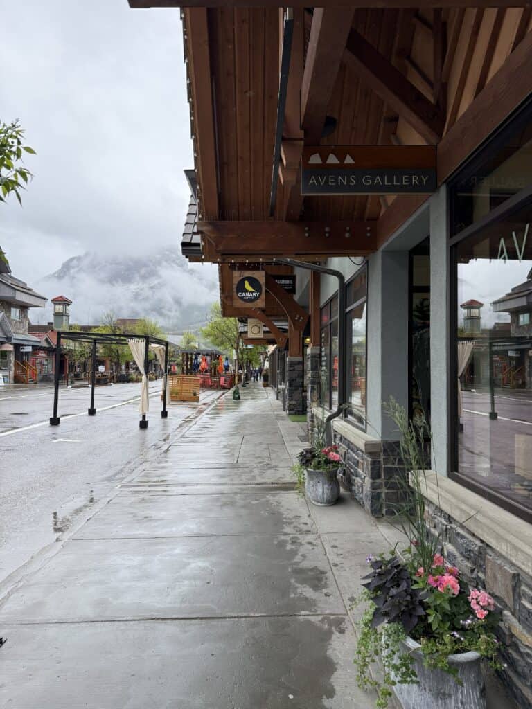 street and store fronts on a rainy day in Canmore, Alberta.