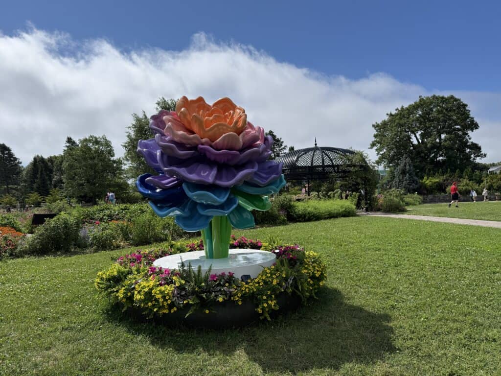 colourful flower sculpture surrounded by flower bed on lawn in hendrie park at royal botanical gardens.