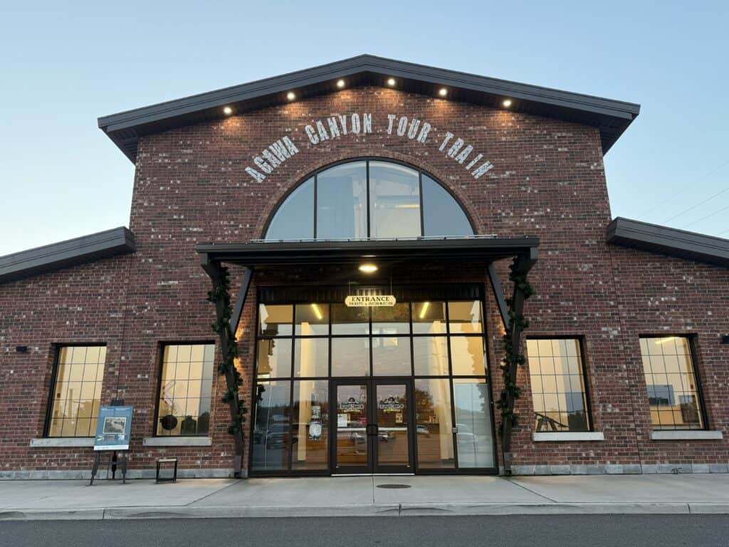 brick exterior and glass entrance doors of agawa canyon tour train depot.